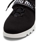 black low top lace up fabric sneakers