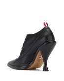 curved heel pebbled brogues