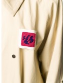 patch-embellished oversized trench coat