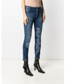 lace-appliqué skinny jeans